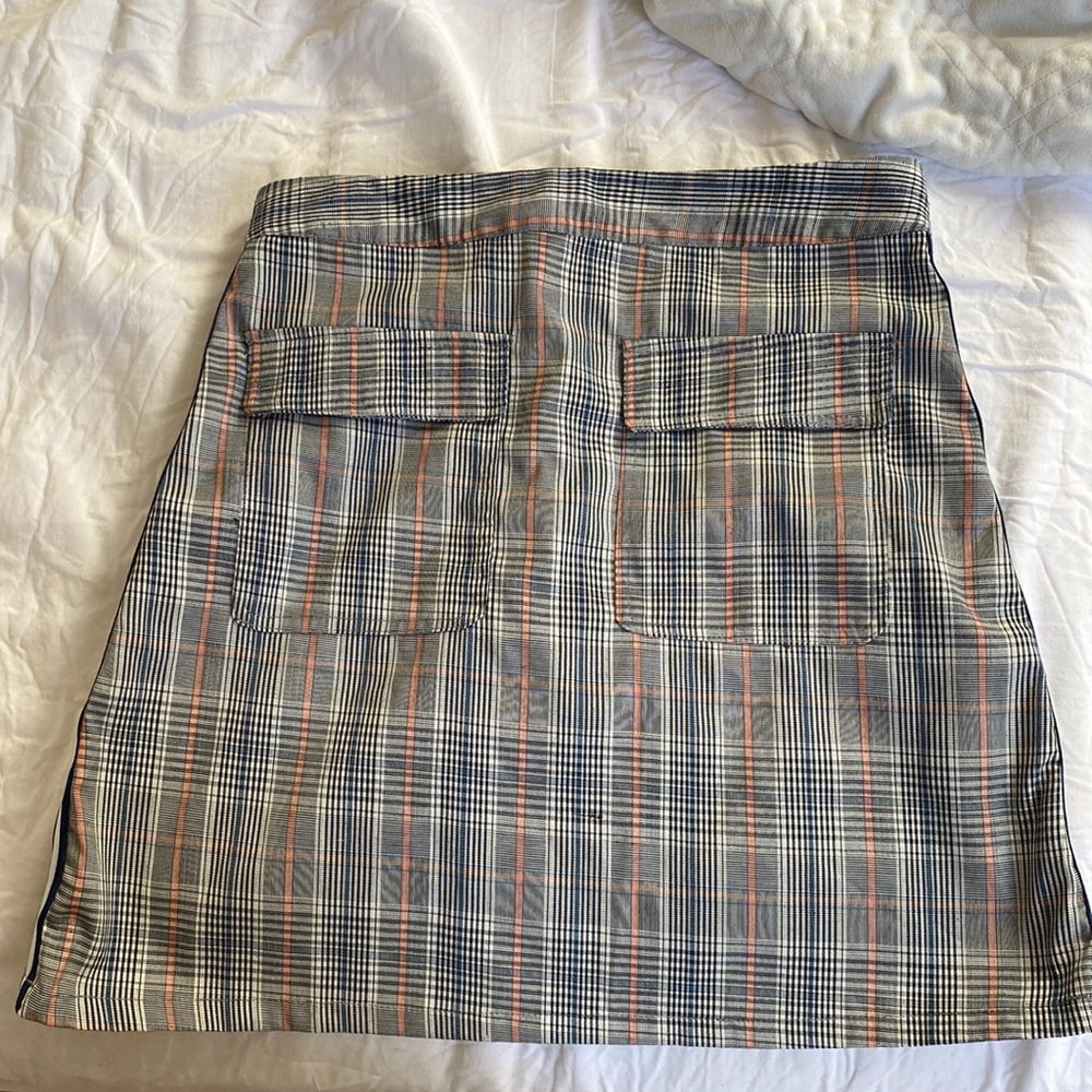 plaid skirt with two pockets from Bonanza s/m and about 3.5in above the knee